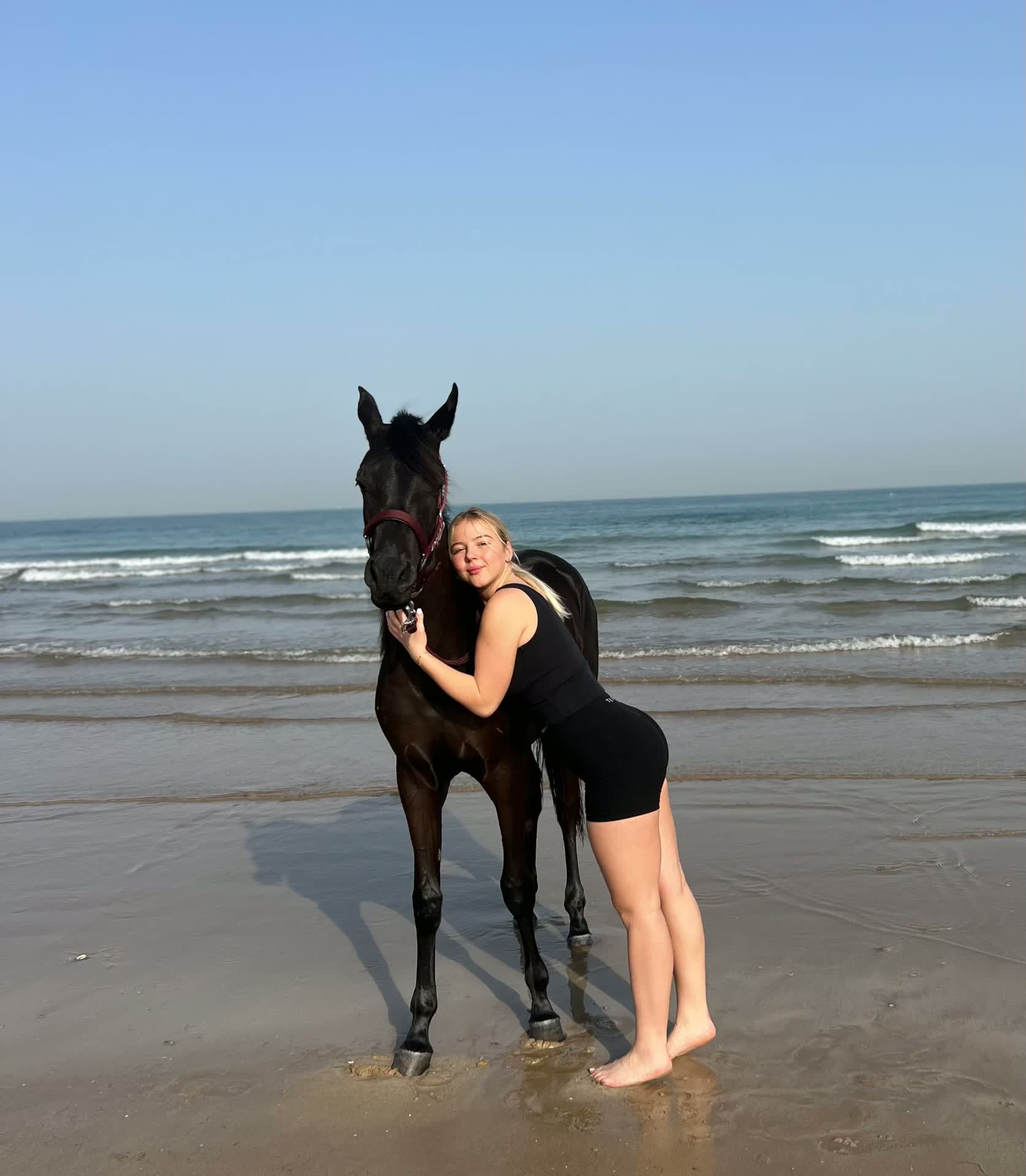 Mercedes Reuter on a brand shoot on a beach in Dubai